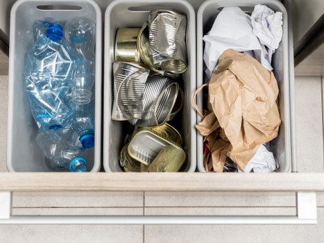 Workers sorting recyclables at a commercial recycling point